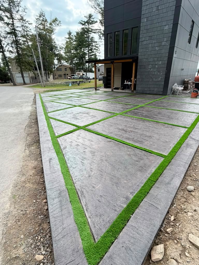 Stamped concrete drive with turf inlay